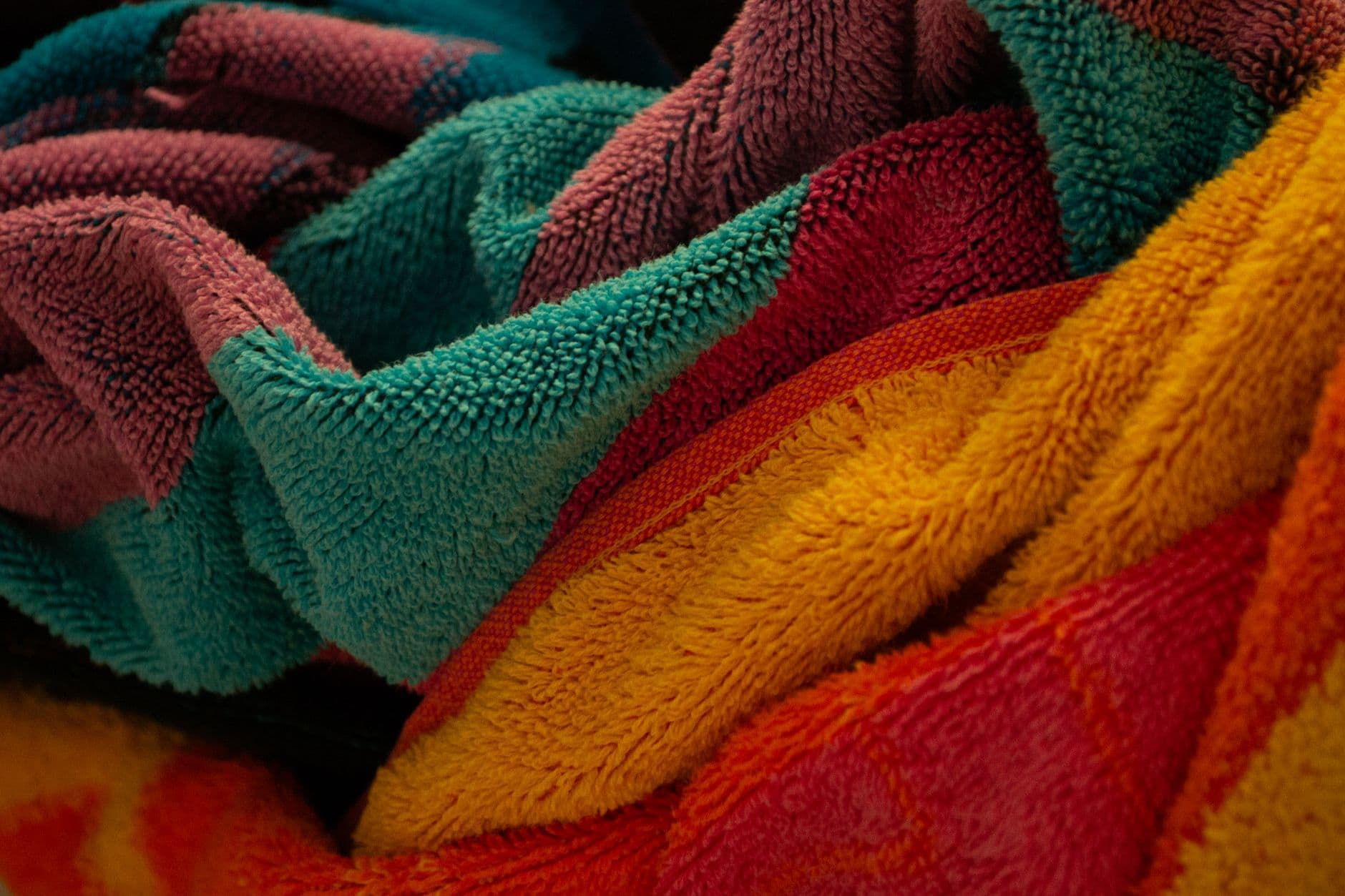 Several bath towel brands folded side by side for comparison